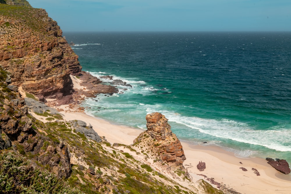 a view of the ocean from the top of a hill