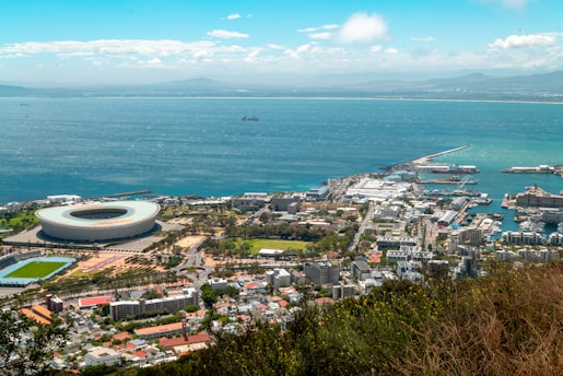 an aerial view of a city by the ocean