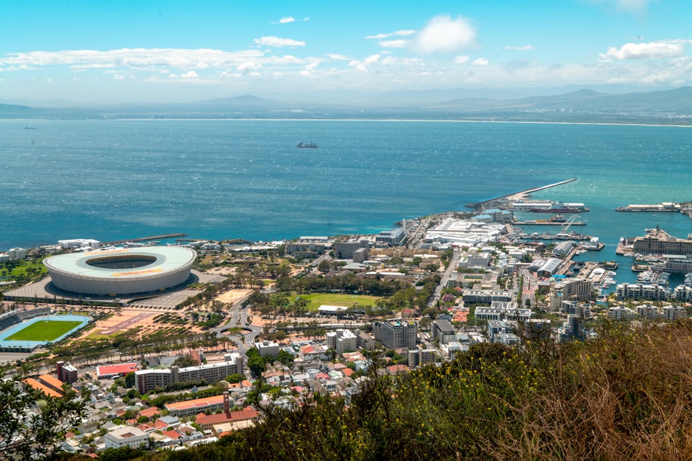 an aerial view of a city by the ocean