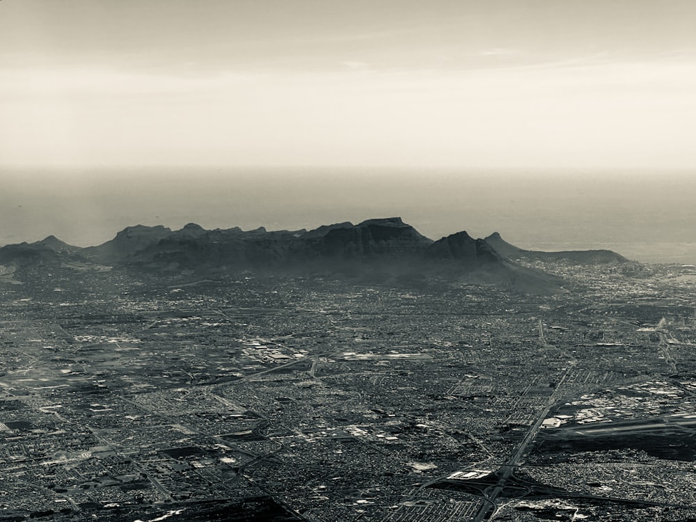 a black and white photo of a mountain range