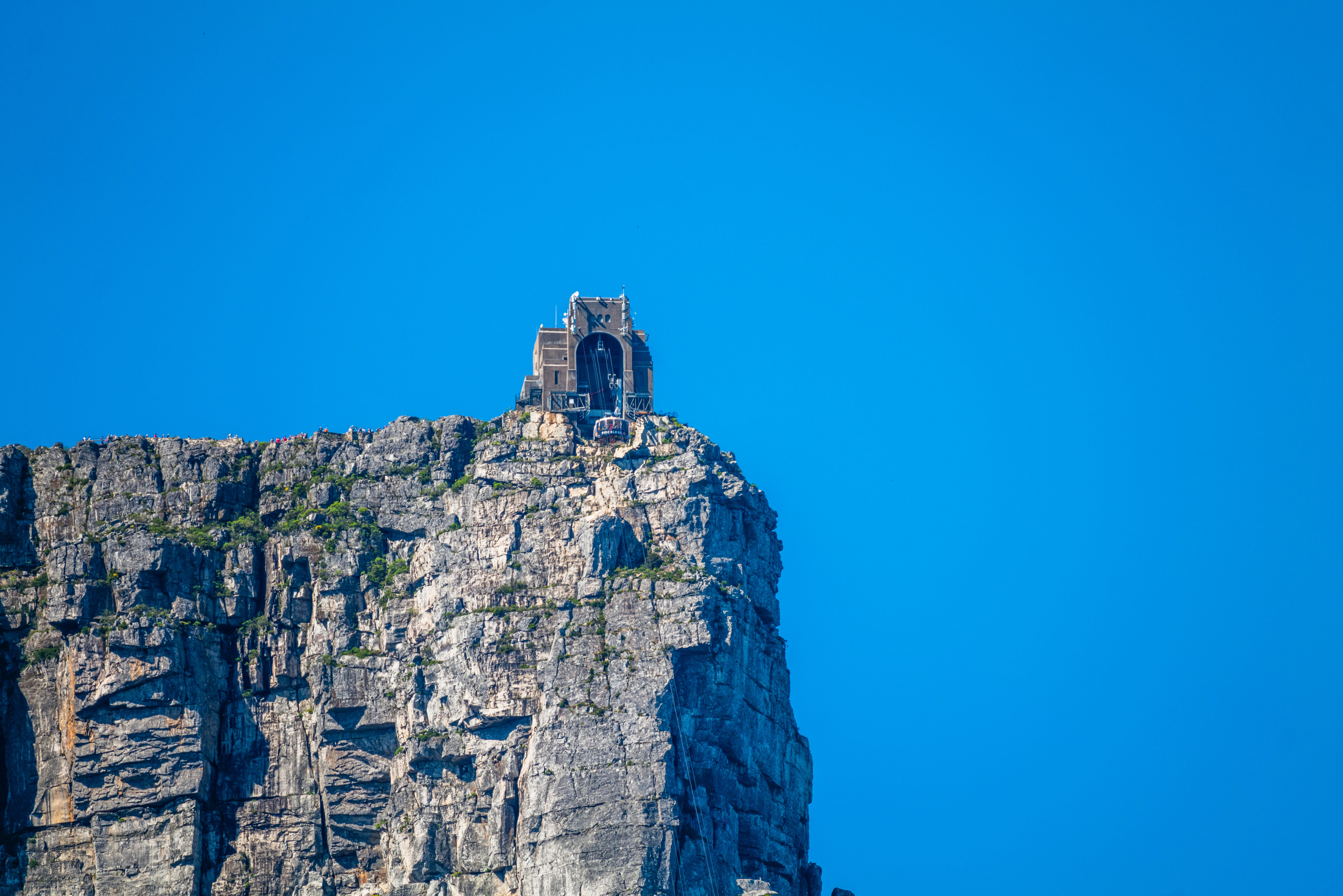 a very tall mountain with a small tower on top of it