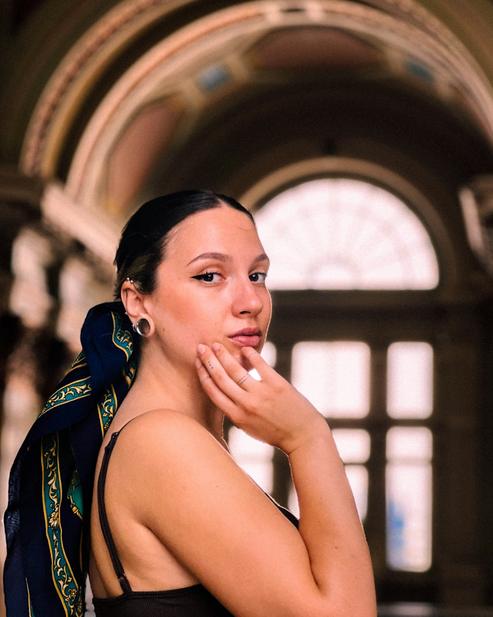 a woman with a scarf around her neck