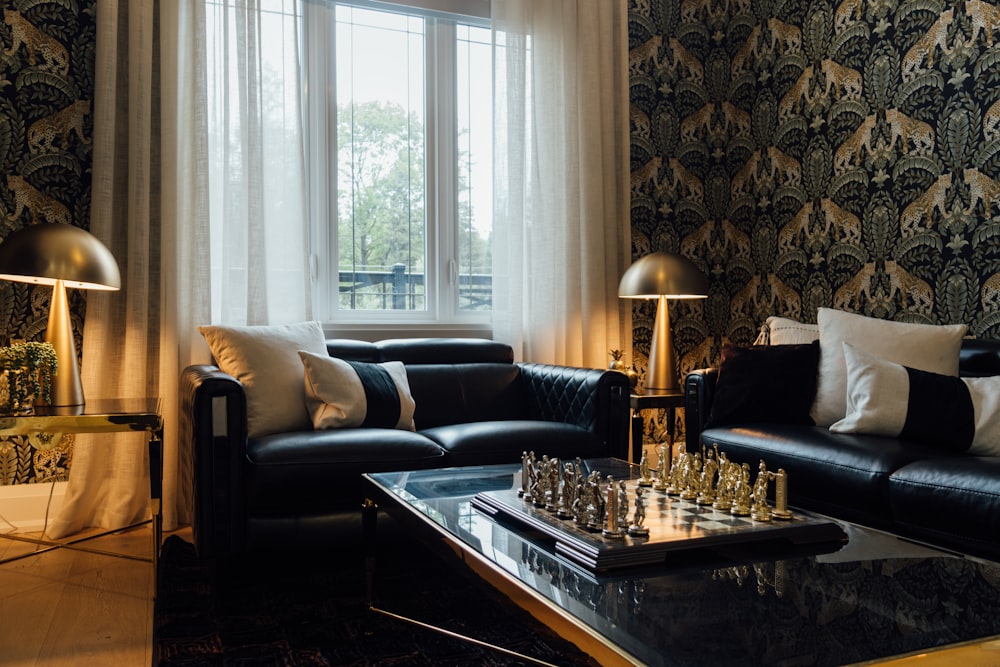 a living room filled with furniture and a large window