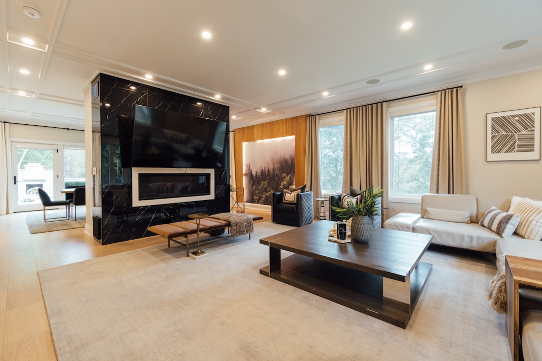 a living room with a couch, coffee table and television,