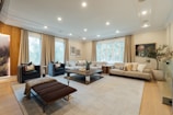 A beautifully designed modern living room with neutral tones.