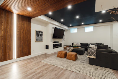 a living room with a couch a chair and a flat screen tv