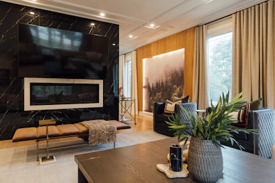 Sleek flat-screen TV mounted neatly above a stylish living room fireplace.