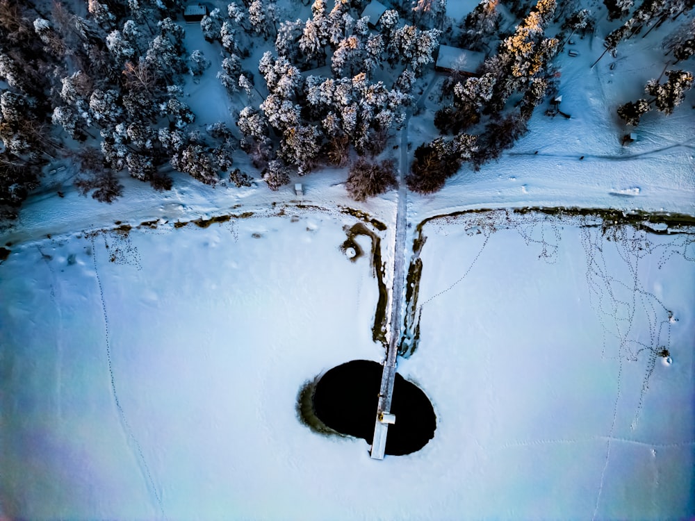 an aerial view of a snow covered forest