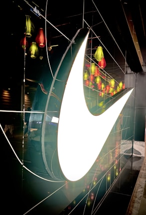 An archival photo of the iconic oversized '22' logo illuminated against a dark broadcast navy background.