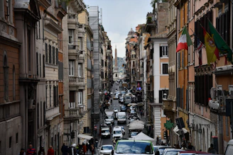 A vibrant street scene in Torino with happy tourists holding city cards near historic landmarks.