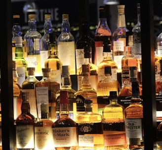 a display case filled with lots of bottles of liquor