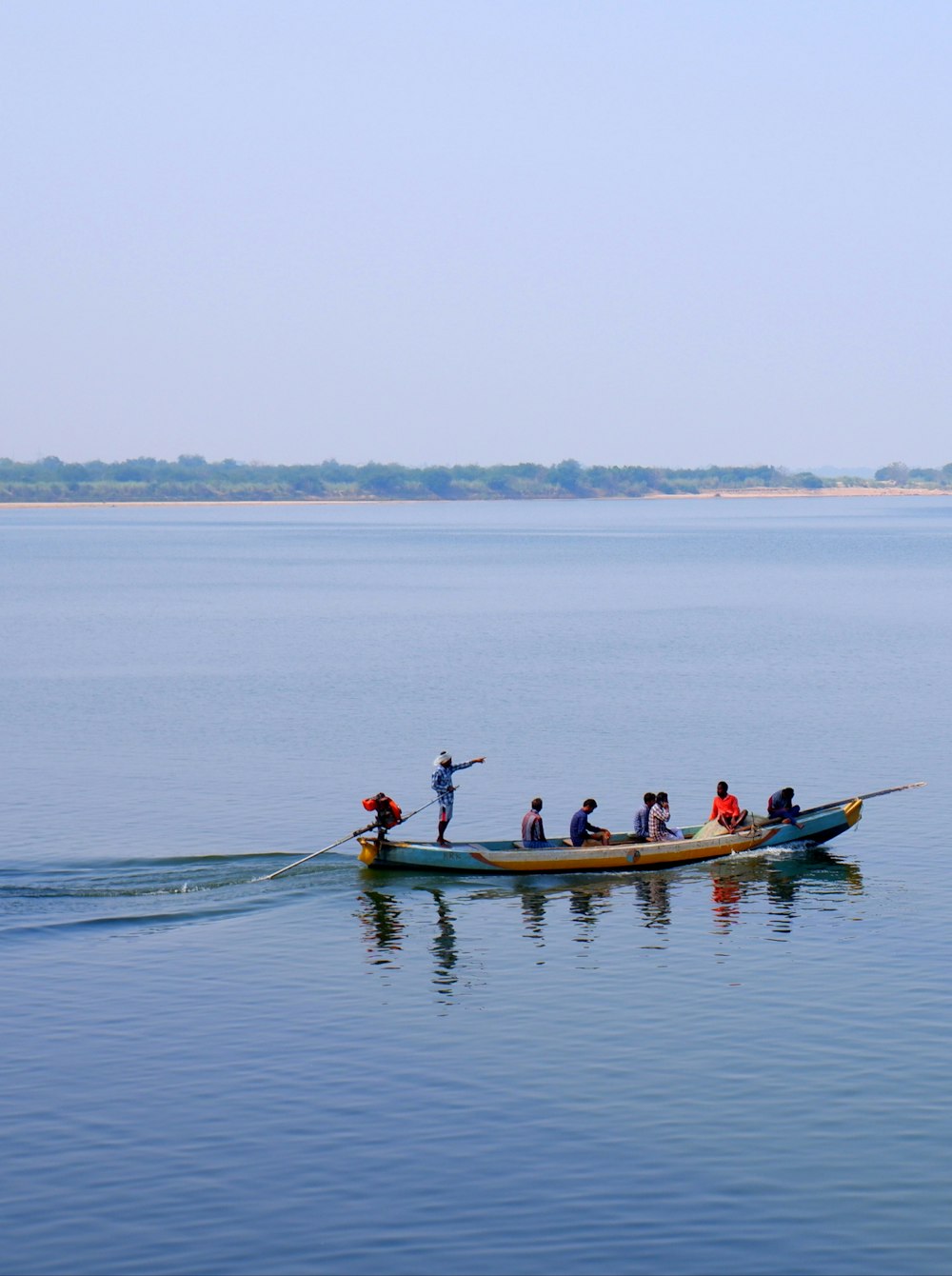 a group of people riding on the back of a boat