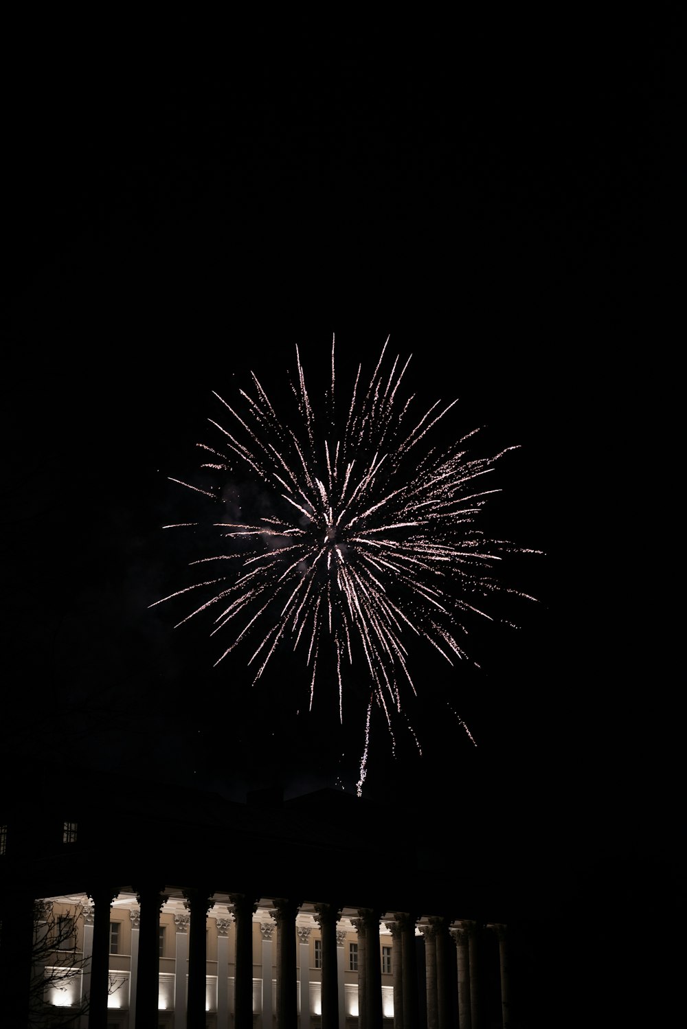 a fireworks is lit up in the night sky