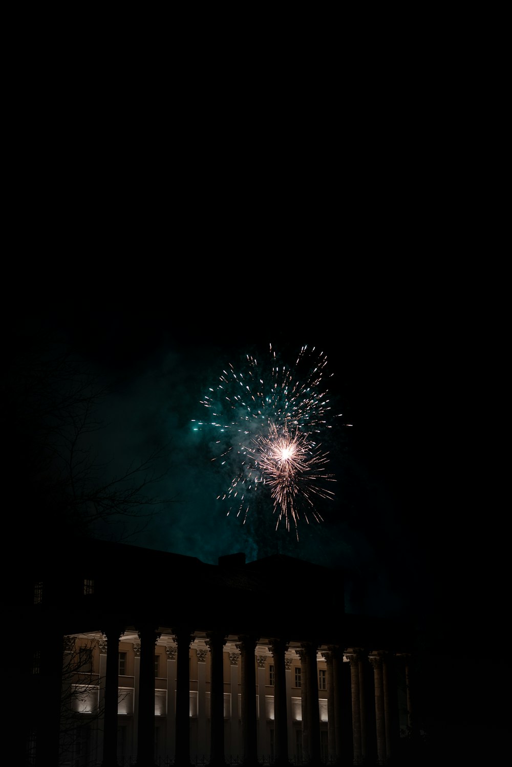 a fireworks is lit up in the night sky