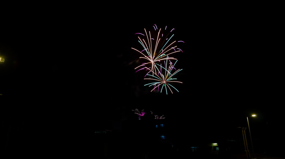 a fireworks display in the night sky