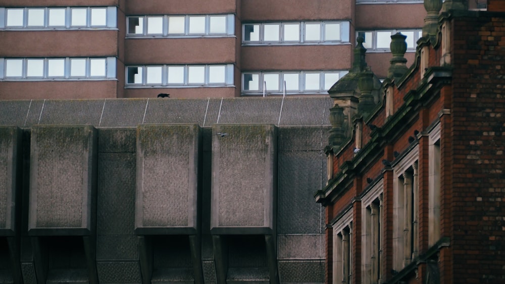 a tall building next to a tall brick building