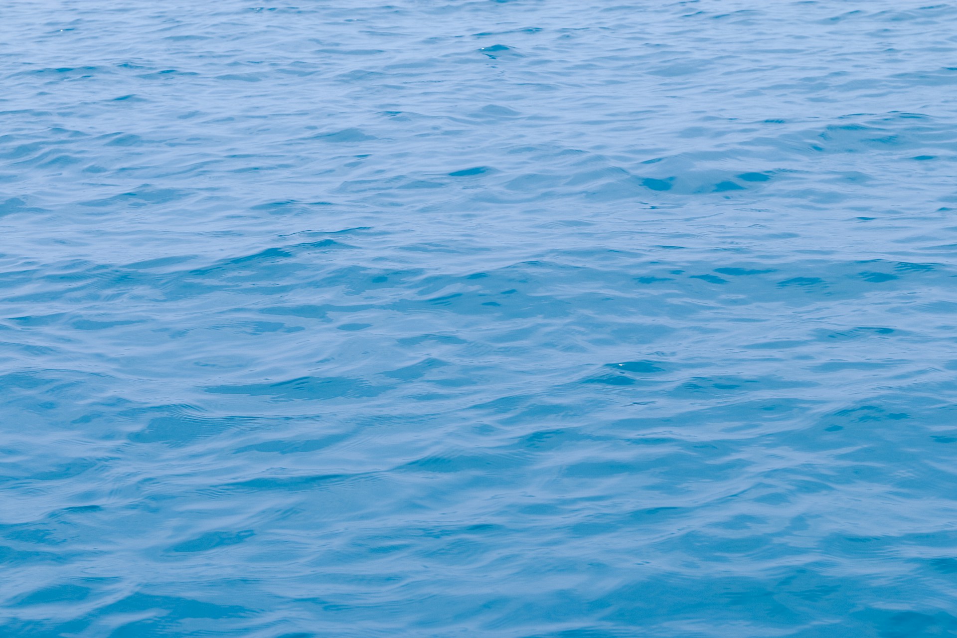 a boat floating on top of a large body of water