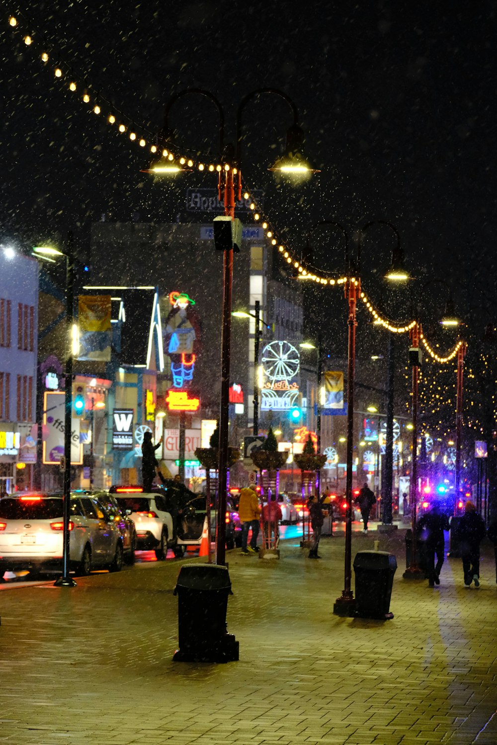 a city street at night with a lot of lights