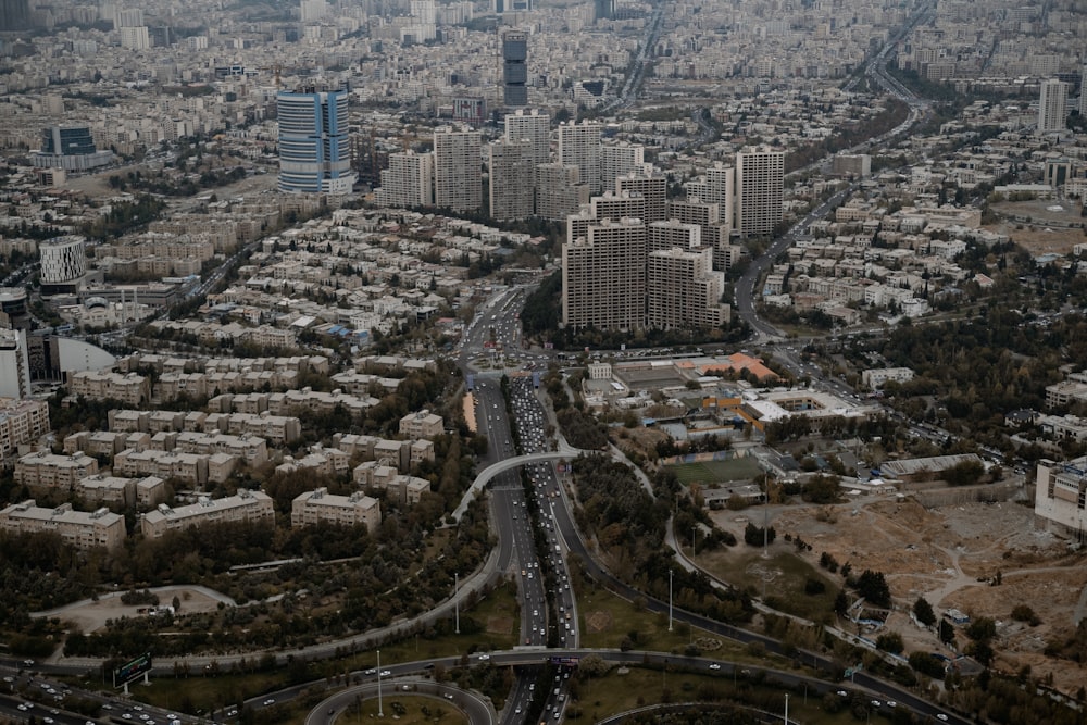 an aerial view of a city with lots of tall buildings