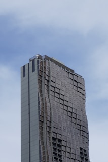 a very tall building with a sky background