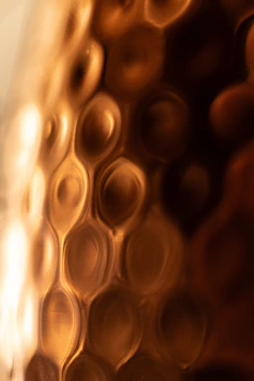 a close up of a glass with some liquid in it