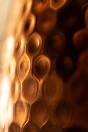 a close up of a glass with some liquid in it