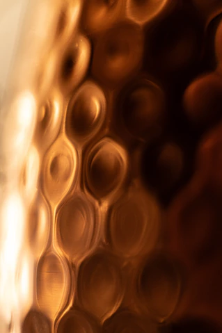 a close up of a glass with some liquid in it