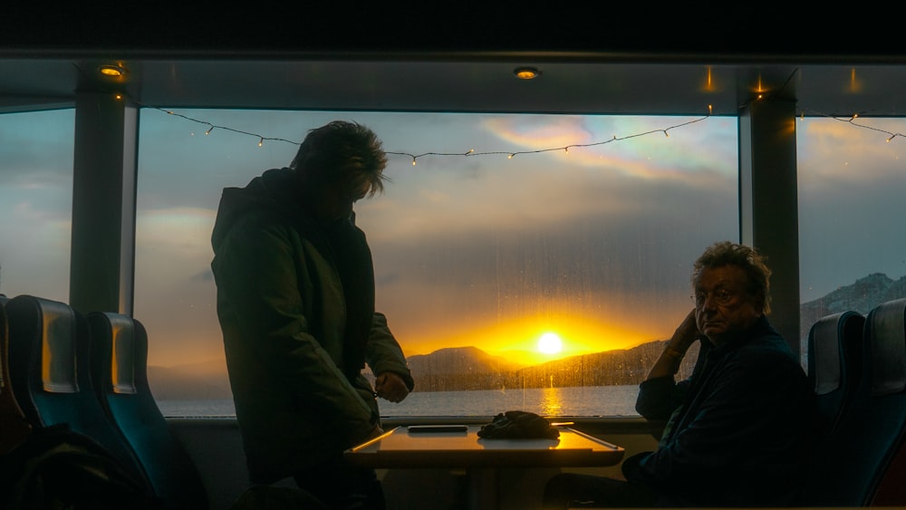 a couple of people sitting at a table