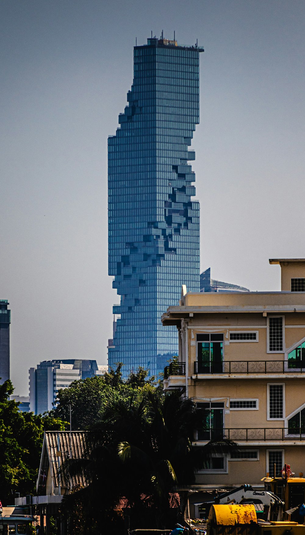 a very tall building towering over a city