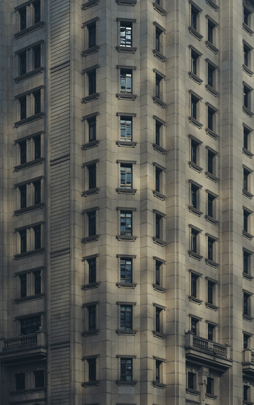 a very tall building with a clock on the side of it