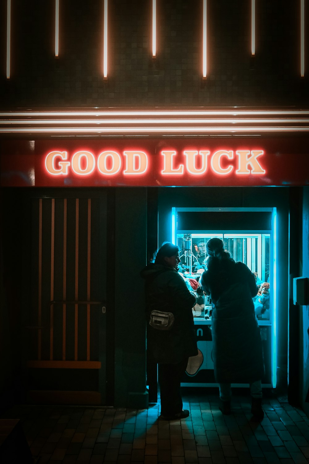 a couple of people standing outside of a building