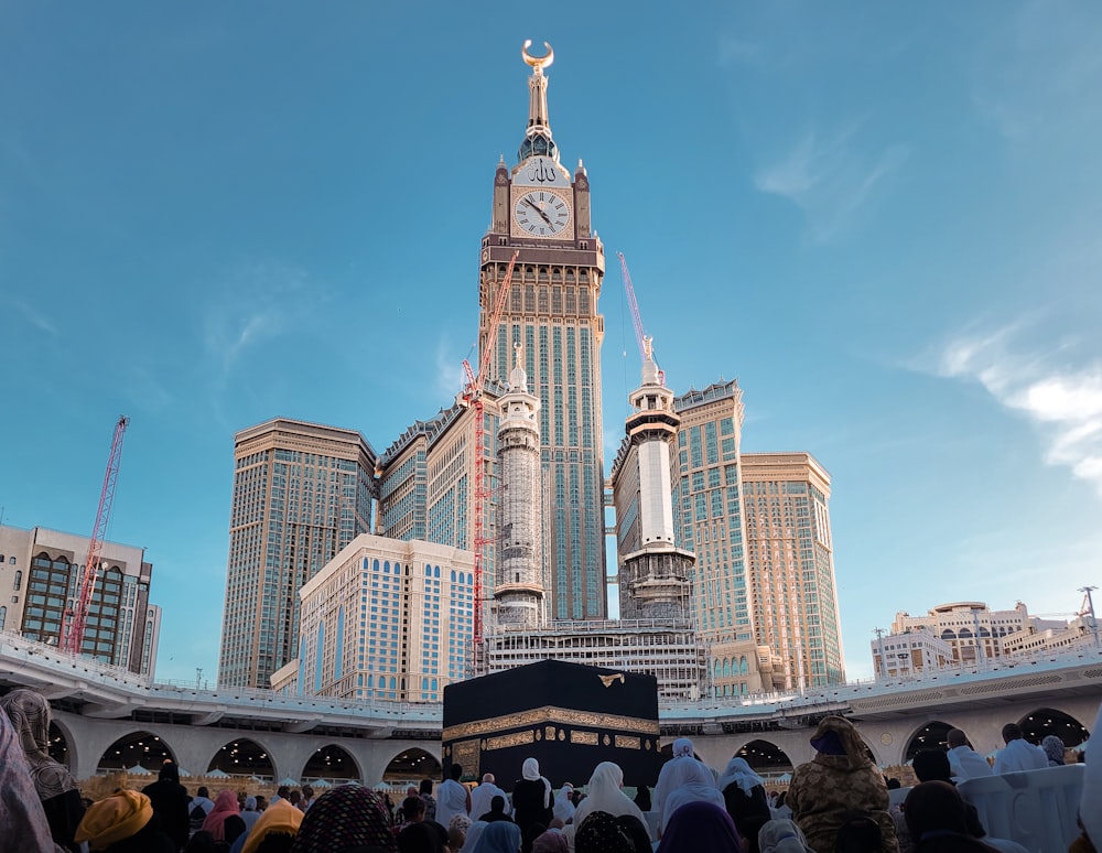 a group of people standing in front of a tall building