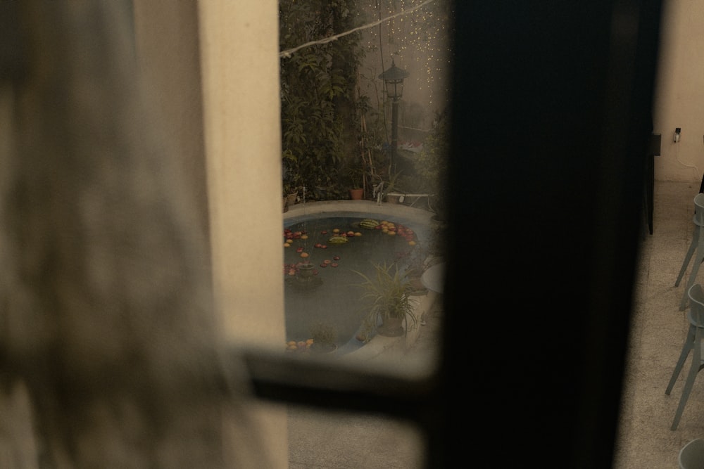 a view of a pool through a window