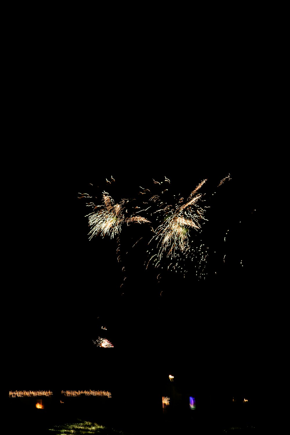 a fireworks is lit up in the dark sky