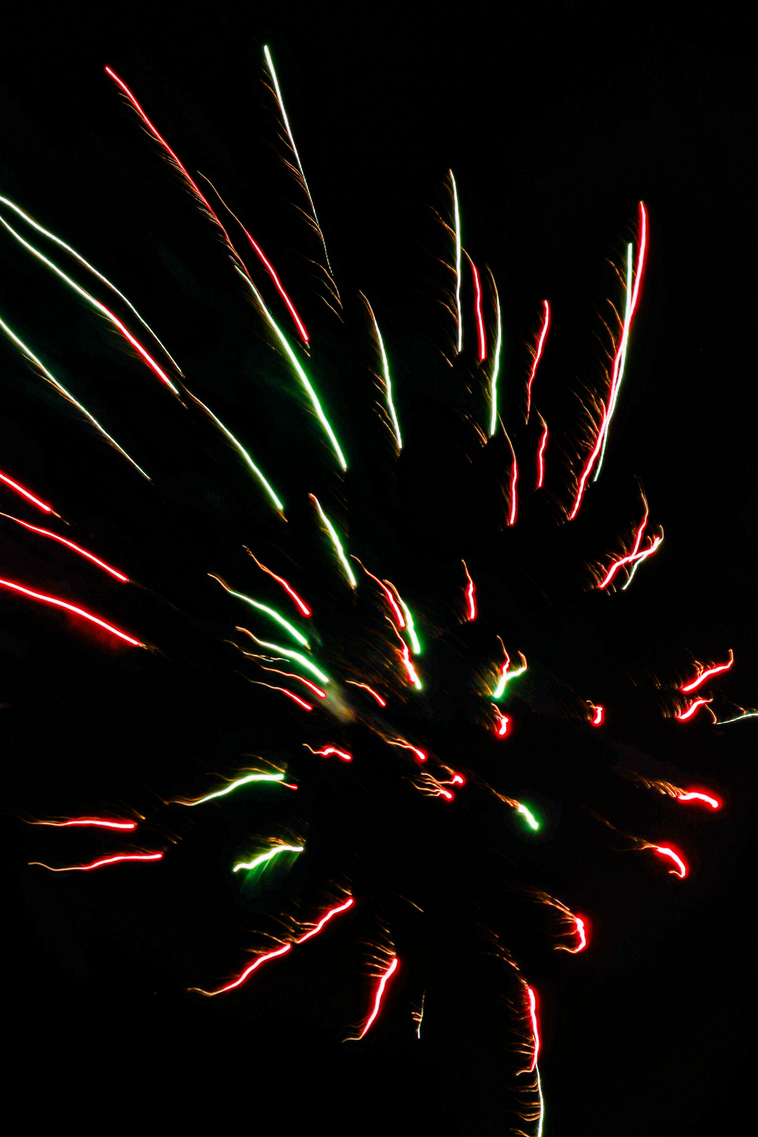 A firework is lit up in the night sky photo – Free Woman Image on Unsplash
