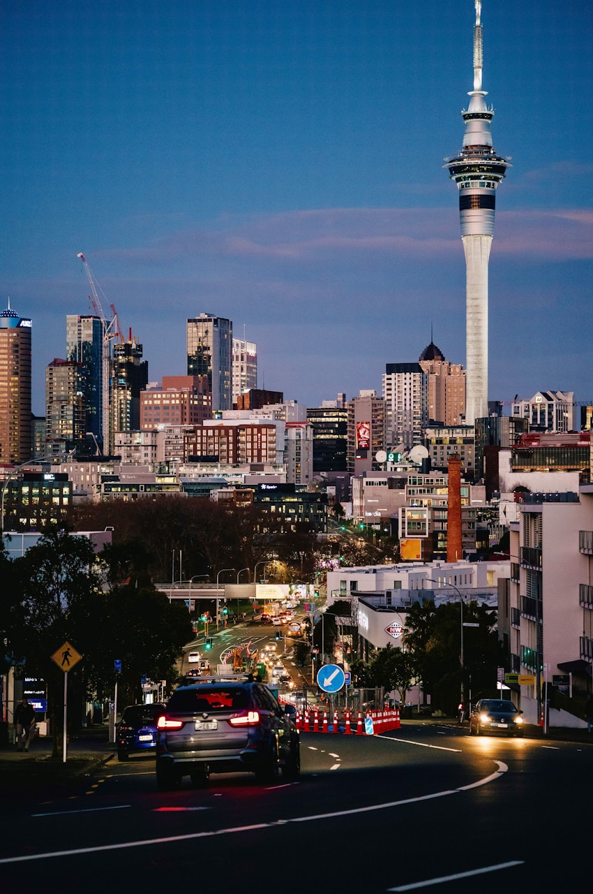 a view of a city with a tall tower in the background