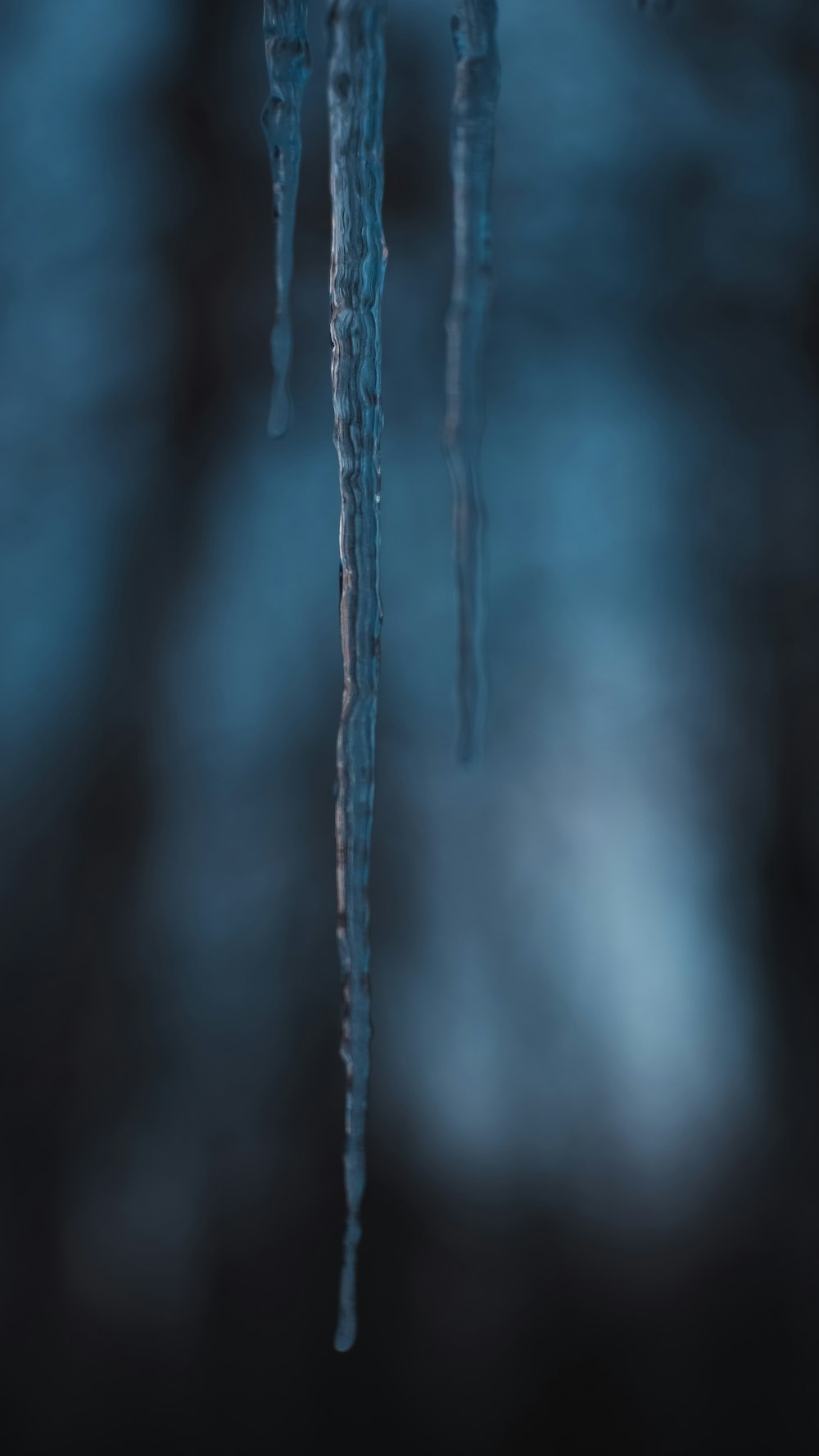 icicles hanging from the ceiling of a dark room