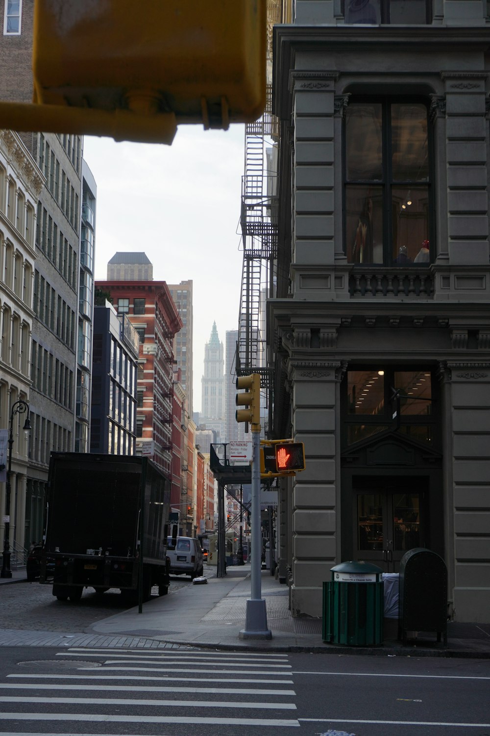 a traffic light on a city street with buildings in the background