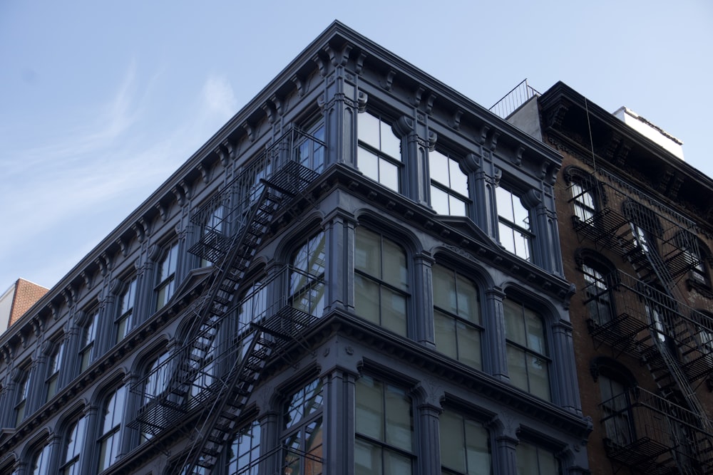 a tall building with lots of windows and a fire escape