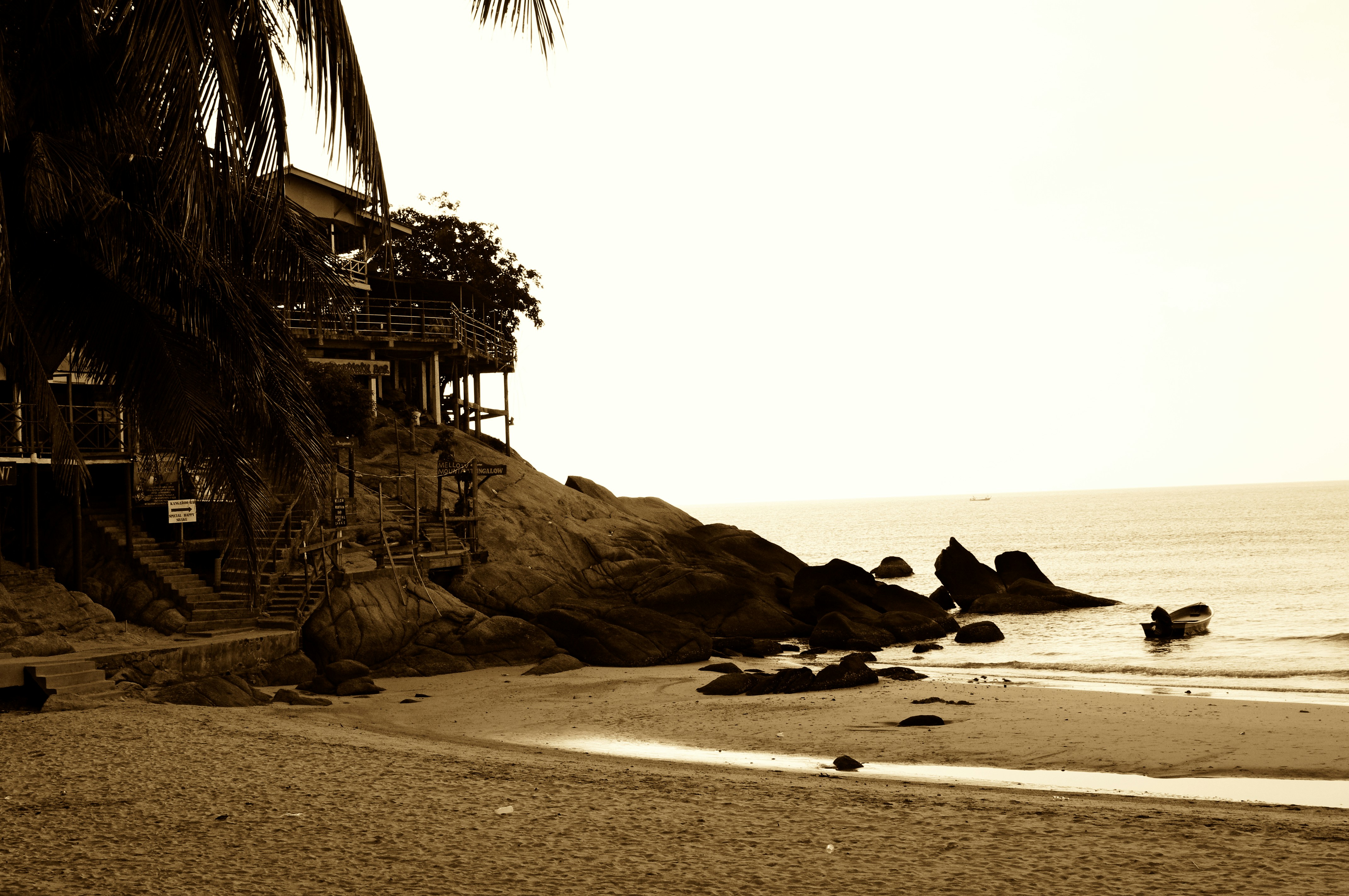 a person riding a surf board on a beach, 