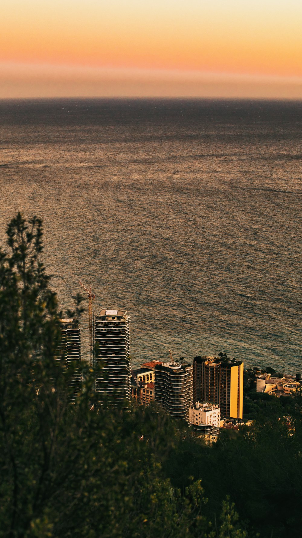 a large body of water next to a city