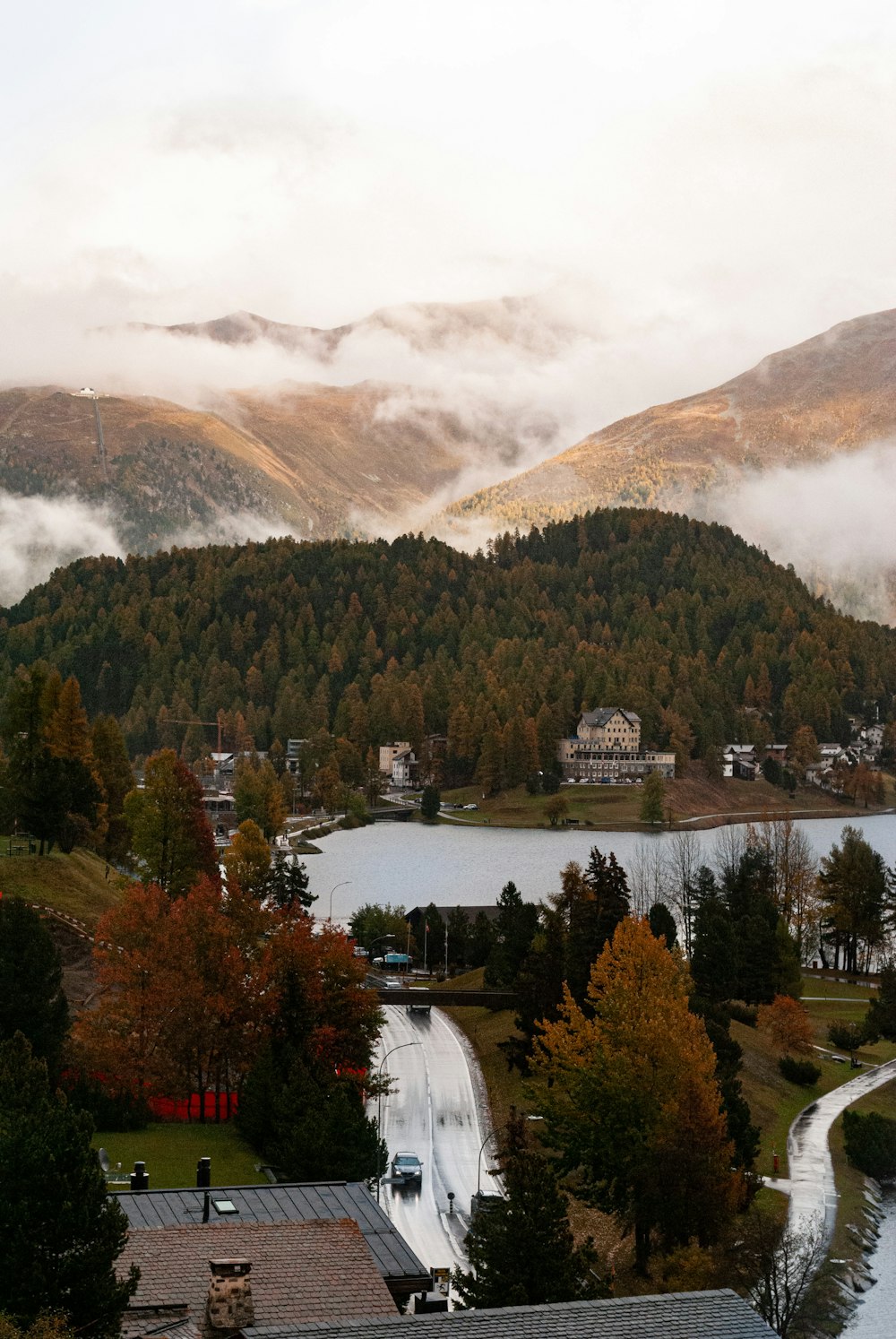 a scenic view of a lake surrounded by mountains