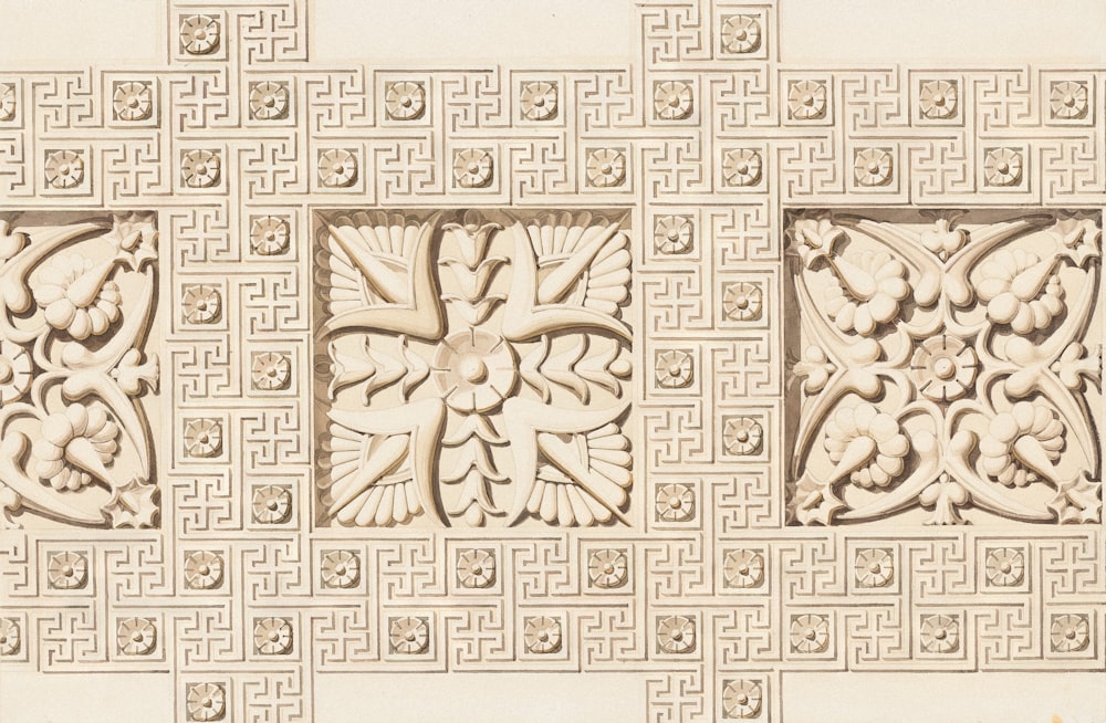 a close up of a wall with a decorative design on it