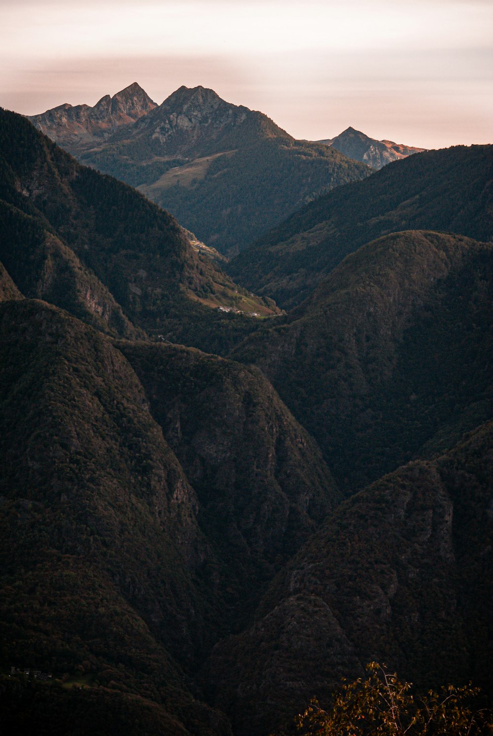 a view of a valley with mountains in the background