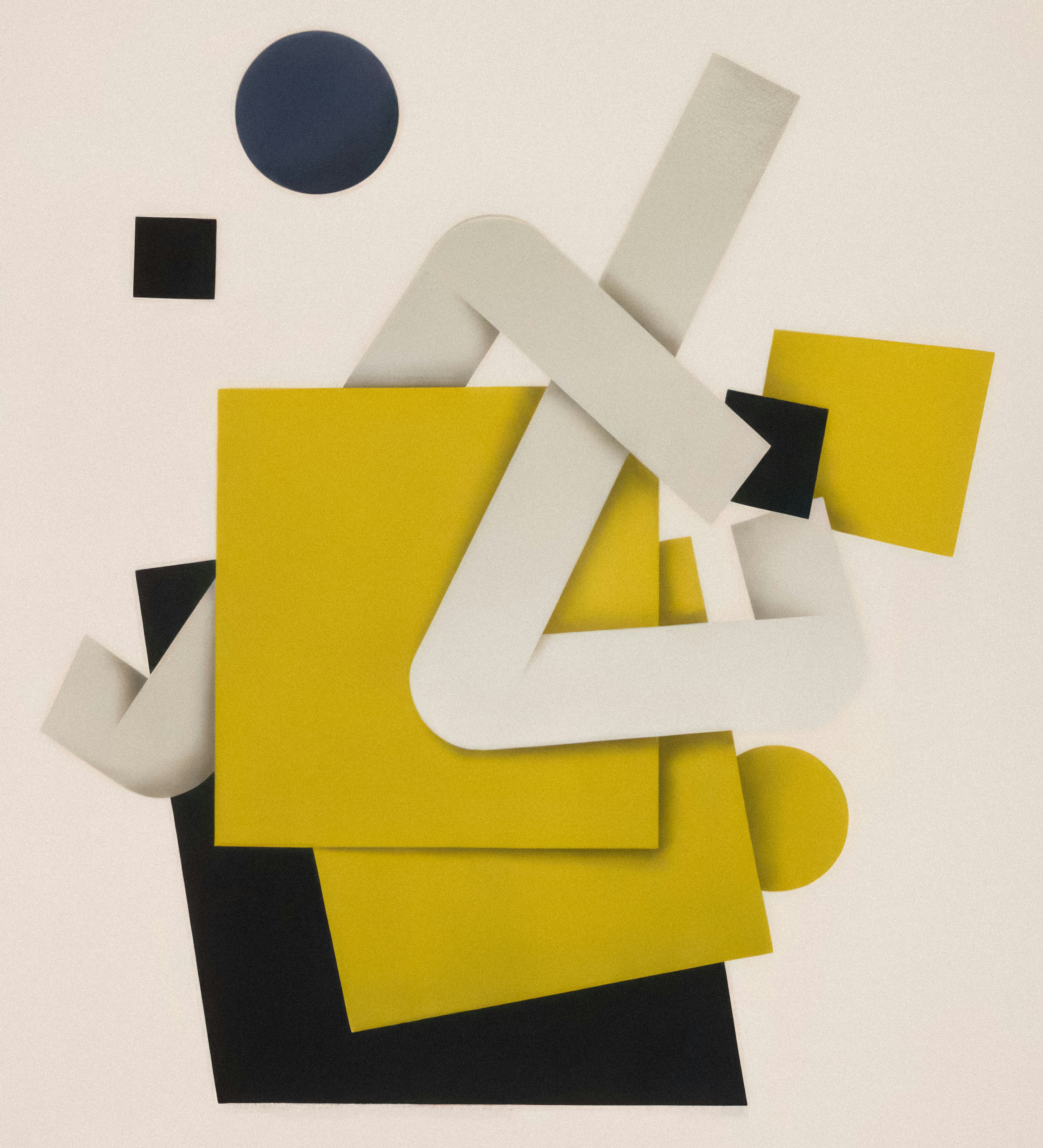 a piece of art that is yellow and black