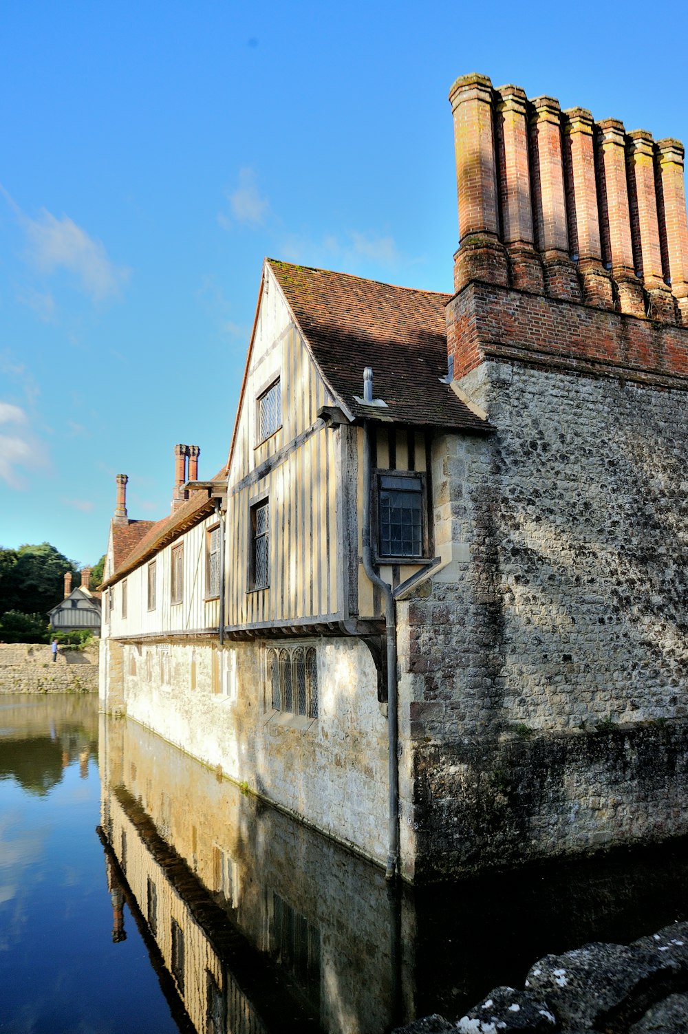 a building next to a body of water