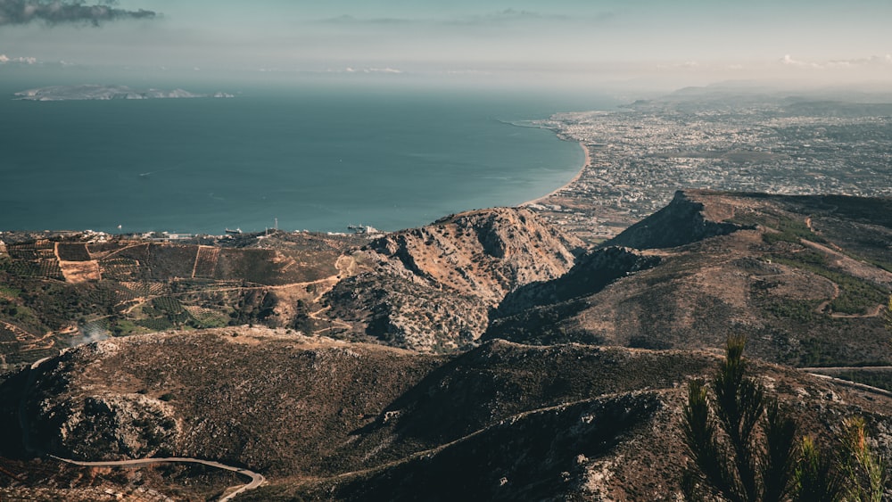 a scenic view of a city and a body of water