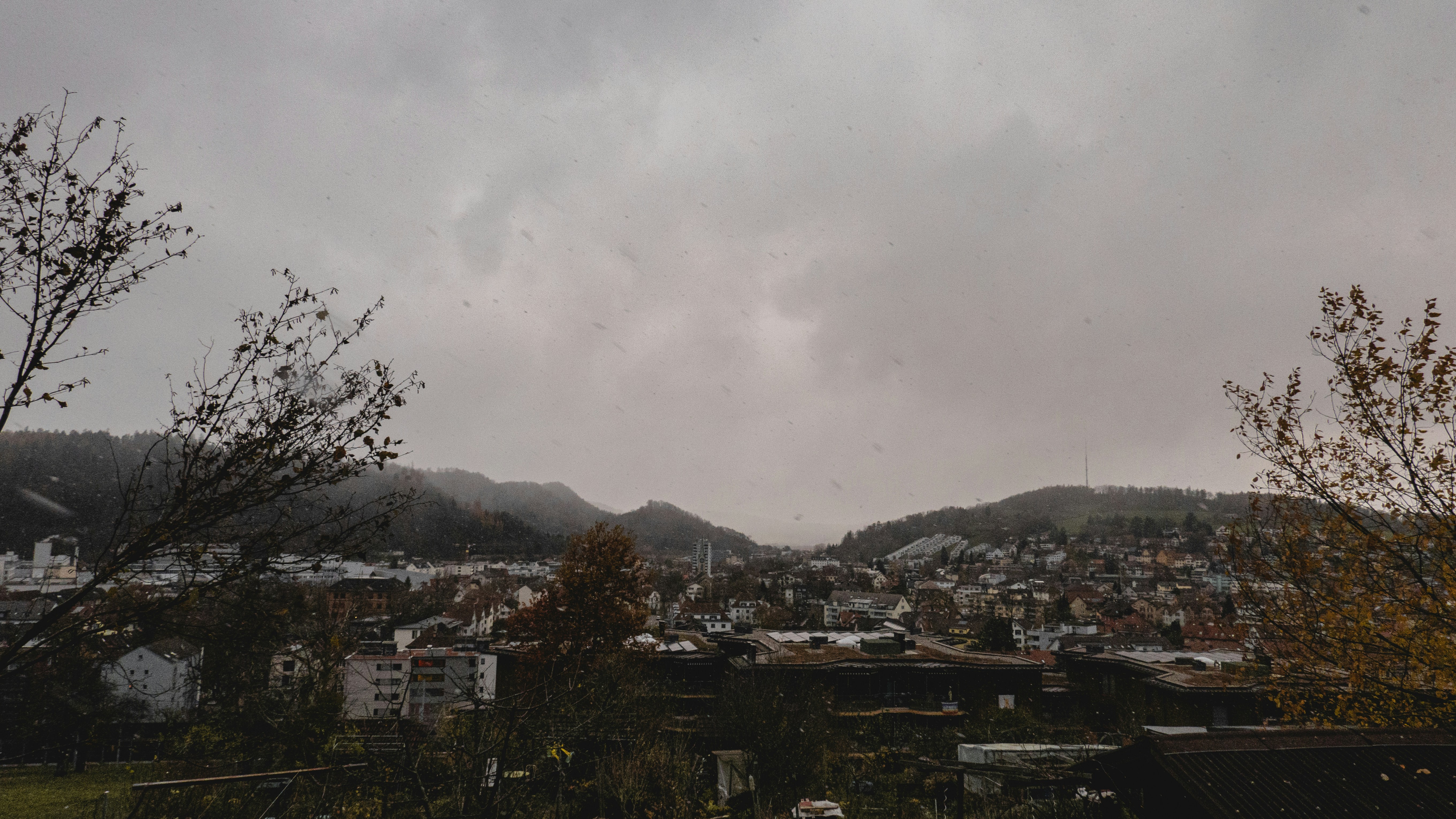 a view of a city with mountains in the background
