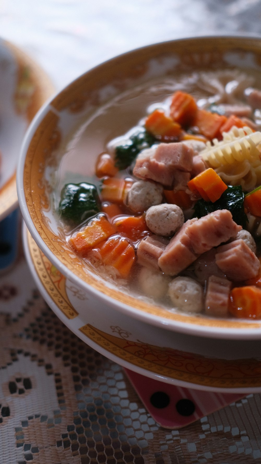 a bowl of soup with meat and vegetables