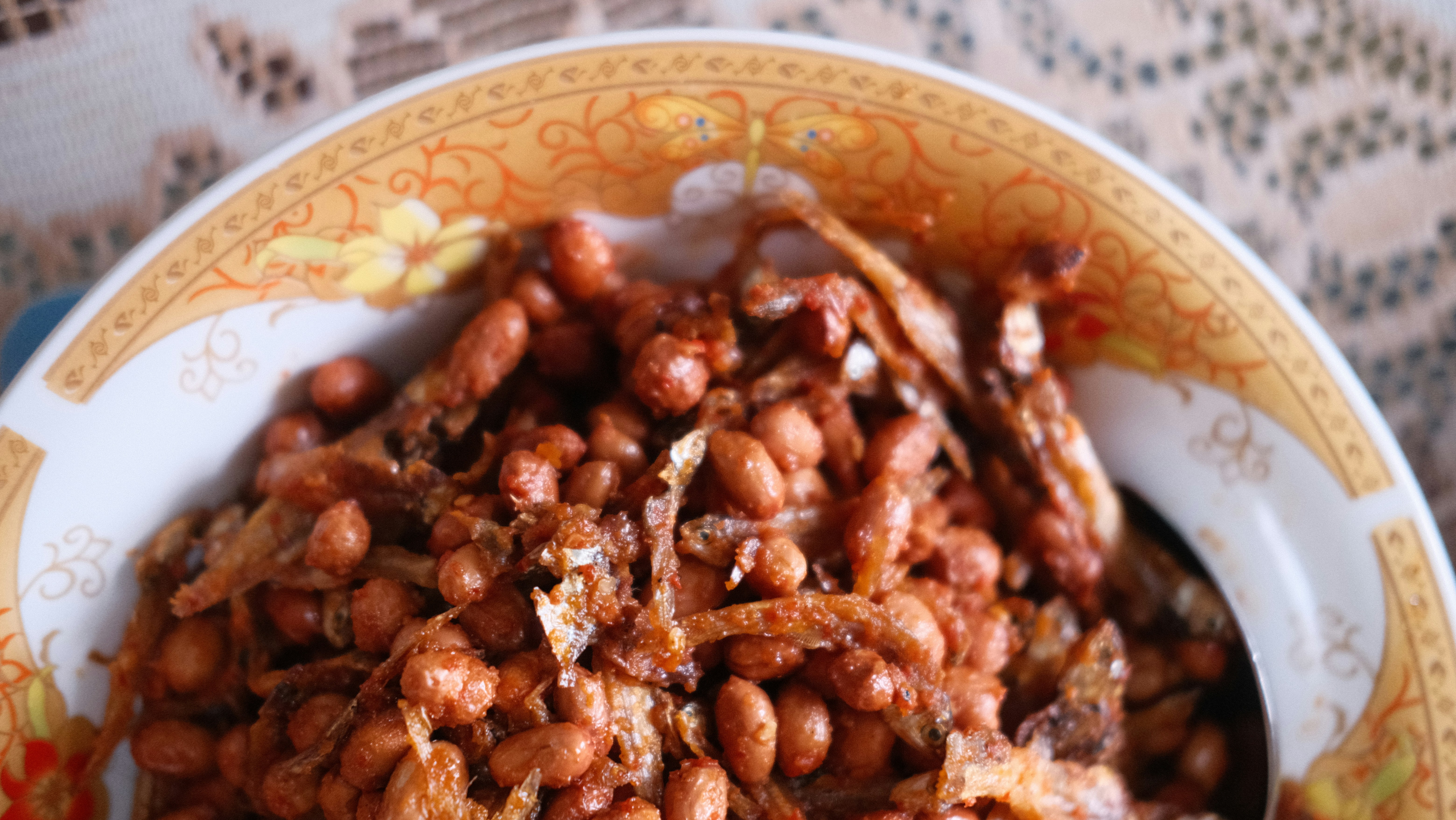 a bowl filled with lots of food on top of a table